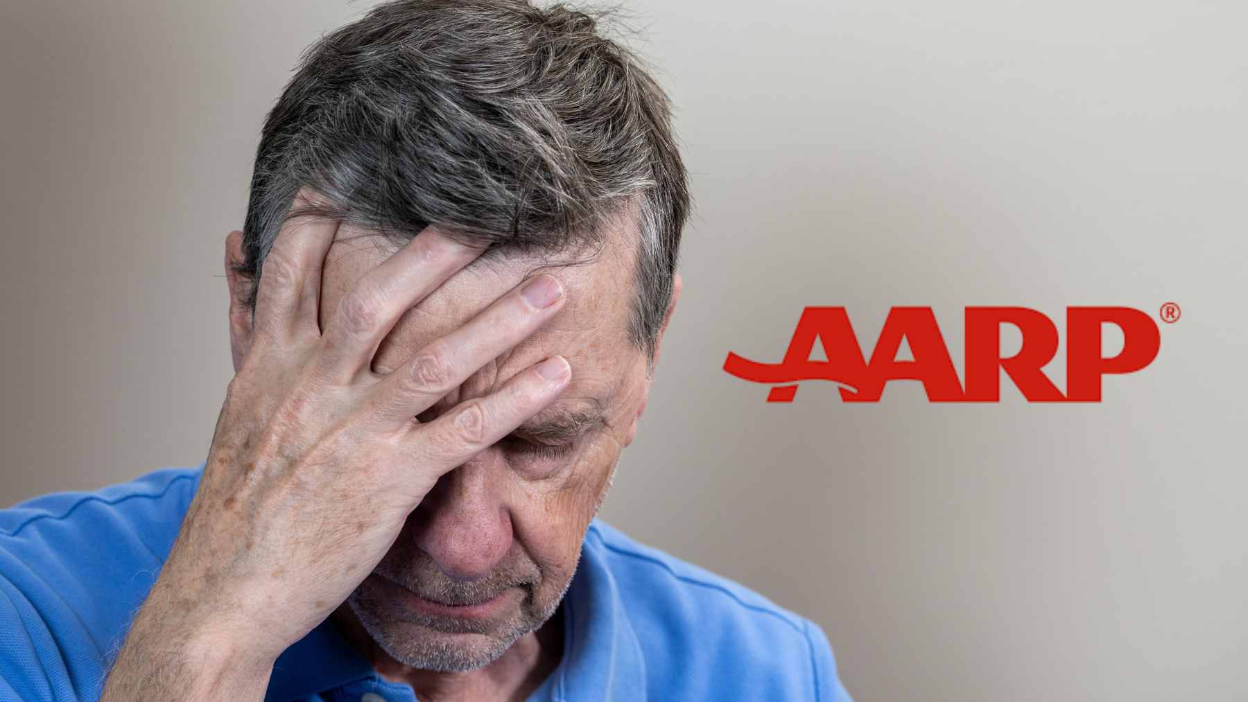 An older worker reviewing financial documents and retirement savings plans at a desk.