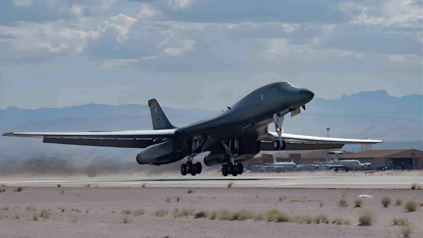 A US Air Force B-1B Lancer bomber landing at RAF Fairford after a long-range mission, showcasing its variable-sweep wing design.