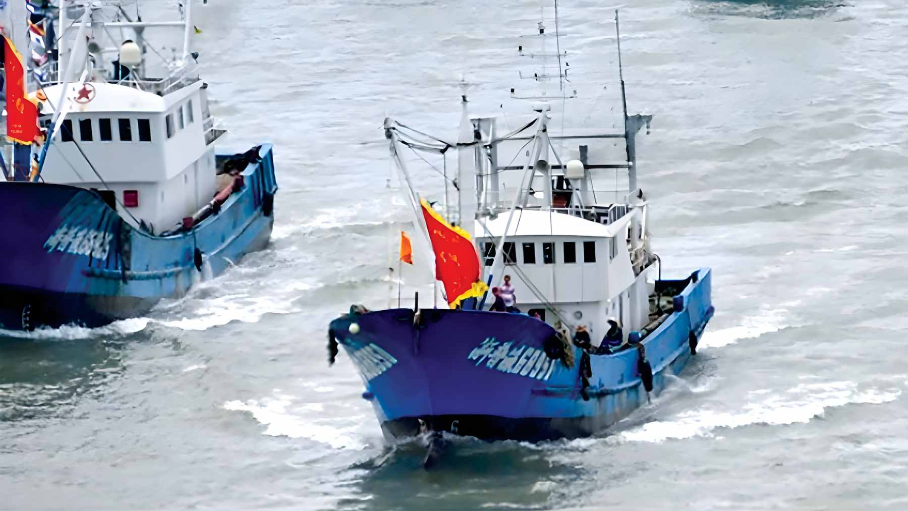 A satellite view of thousands of Chinese fishing vessels gathered in a tight, organized formation near Japan's exclusive economic zone.