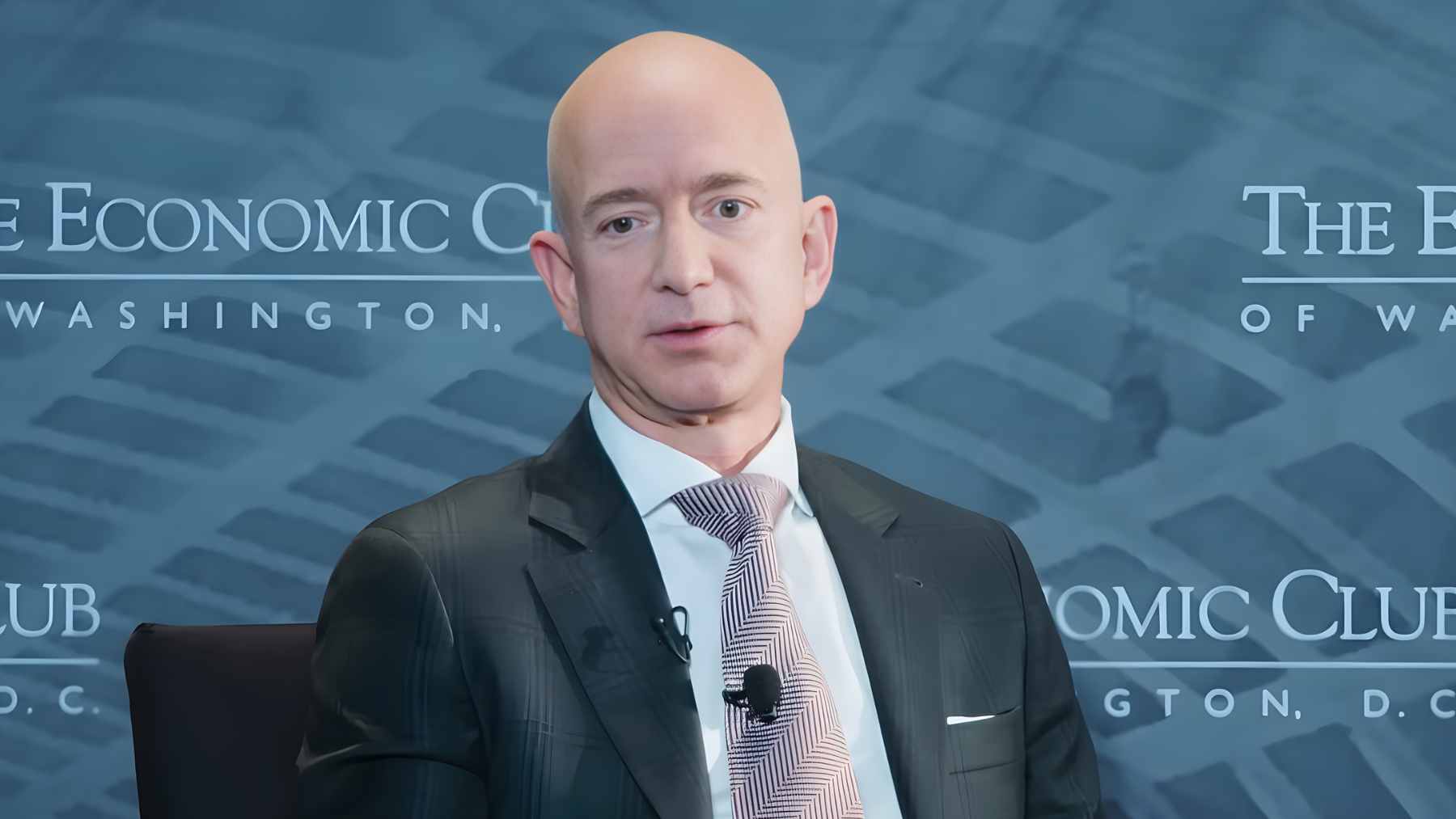 An advanced automated factory floor featuring robotic arms and AI-integrated assembly lines for semiconductor and aerospace parts.