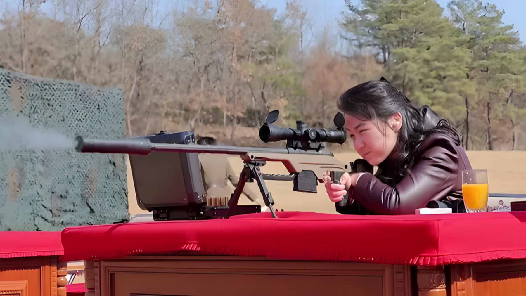 Kim Ju Ae, daughter of North Korean leader Kim Jong Un, aims a high-precision sniper rifle at a Pyongyang shooting range.