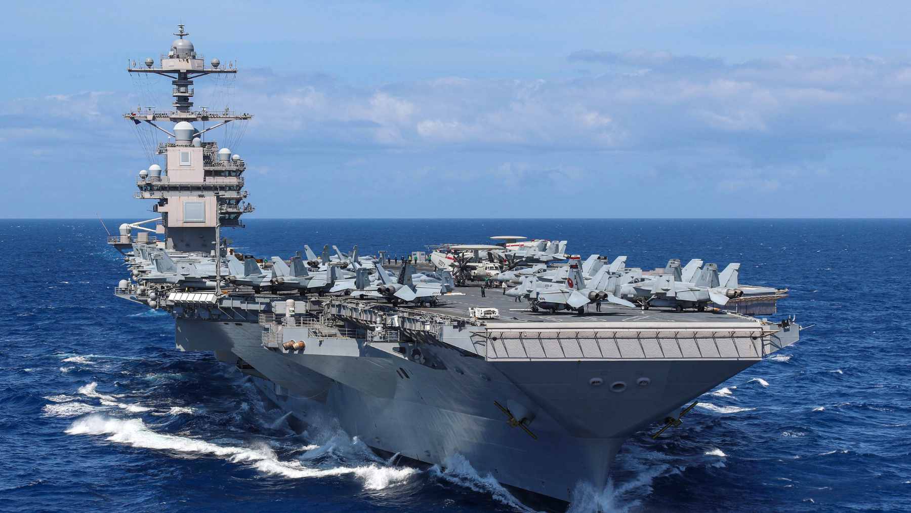 The USS Gerald R. Ford aircraft carrier conducting operations at sea.