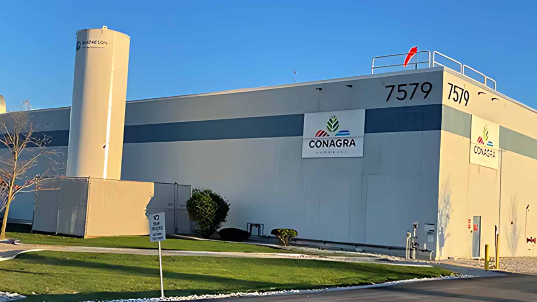 A can of PAM Butter Flavor cooking spray sitting on a kitchen counter next to a frying pan.