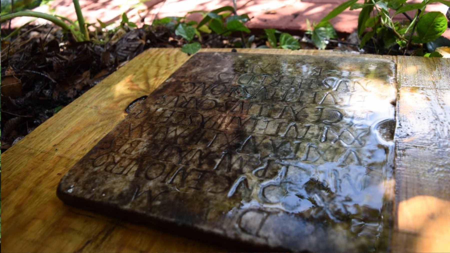 They found a strange stone in their garden, which ended up revealing the lost trail of a Roman archaeological treasure dating back almost 2000 years 1 A close-up of a marble Roman funerary tablet with Latin inscriptions found in a New Orleans backyard.