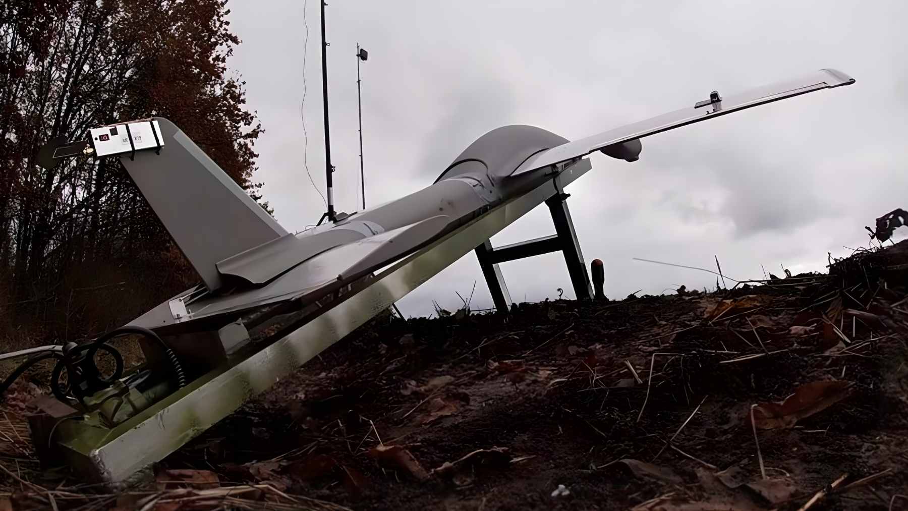 A Russian Molniya drone featuring a plywood and foam airframe, modified with high-definition cameras and additional battery packs for long-range reconnaissance.