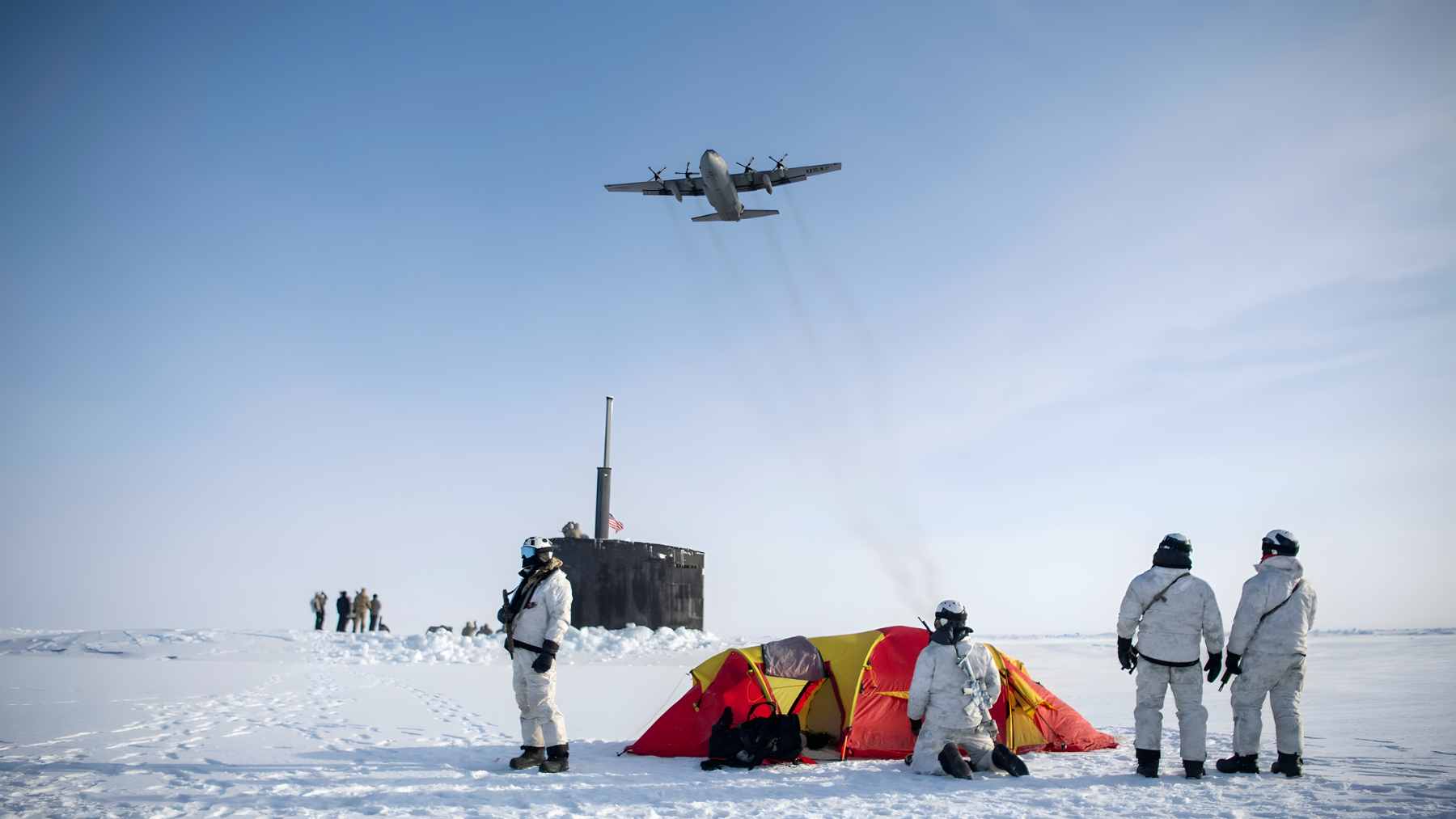 Two U.S. Air Force F-35A Lightning II fighter jets and two F-22 Raptors flying in formation alongside a Russian Tu-142 maritime reconnaissance aircraft over the Arctic.