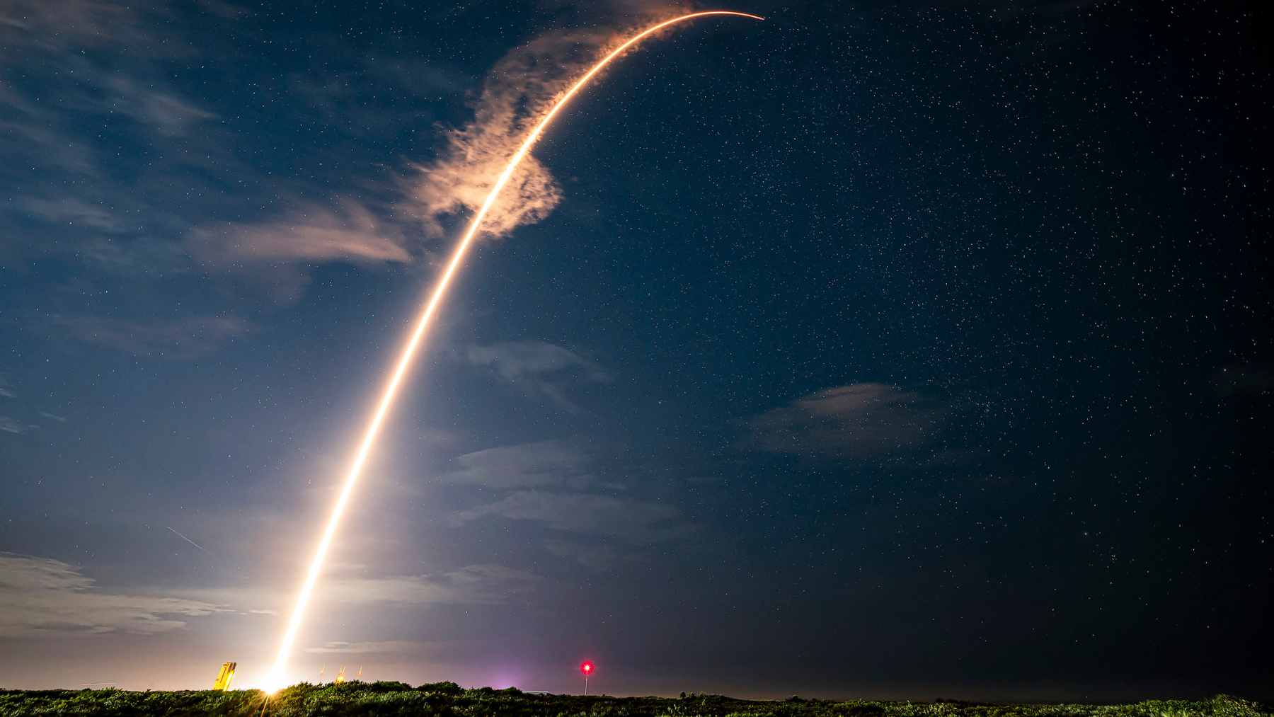 A high-tech optical satellite communication terminal emitting a pinpoint laser beam for secure space-to-ground data transfer.