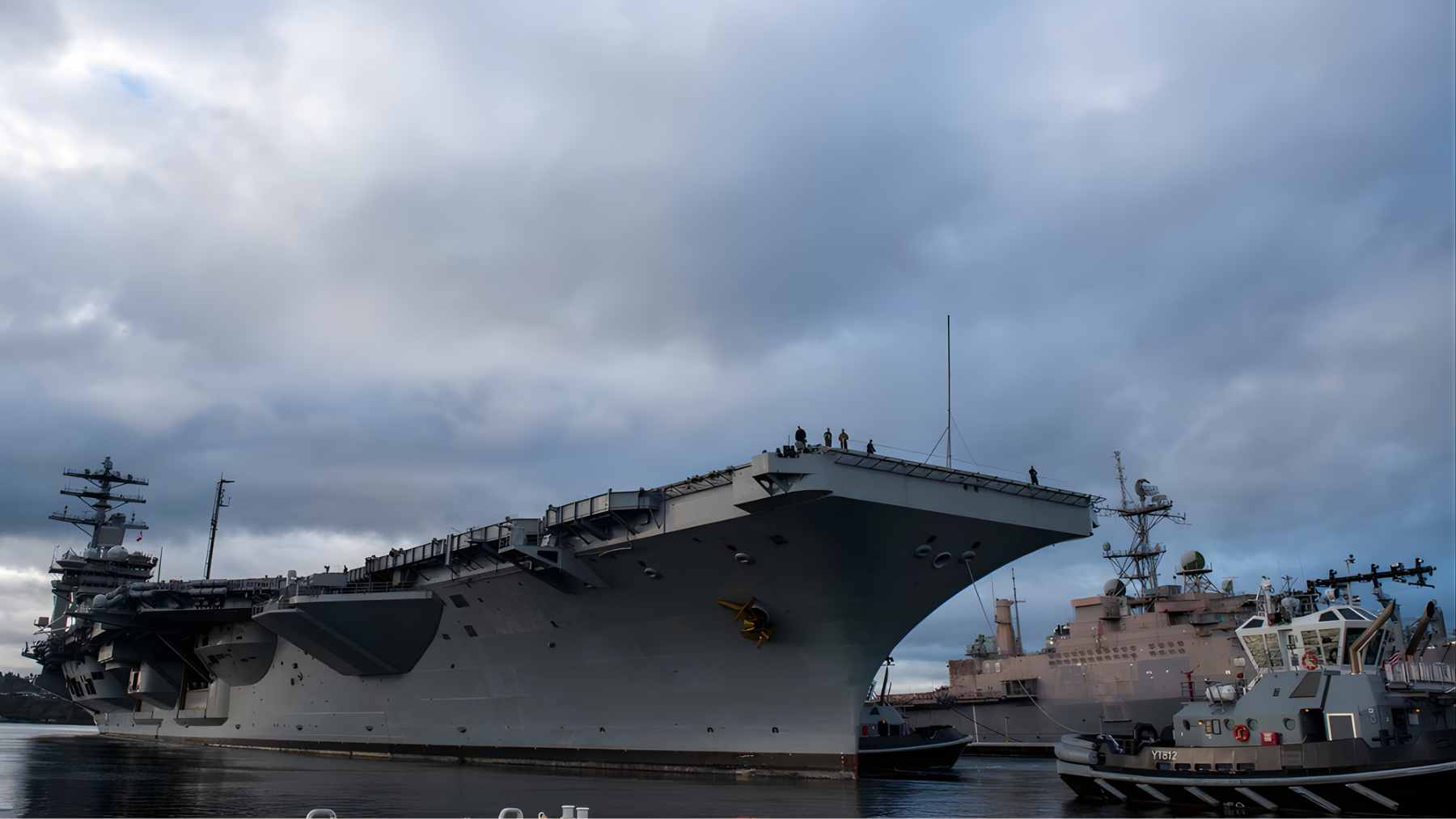 The USS Nimitz aircraft carrier sailing on the open ocean during its final deployment.