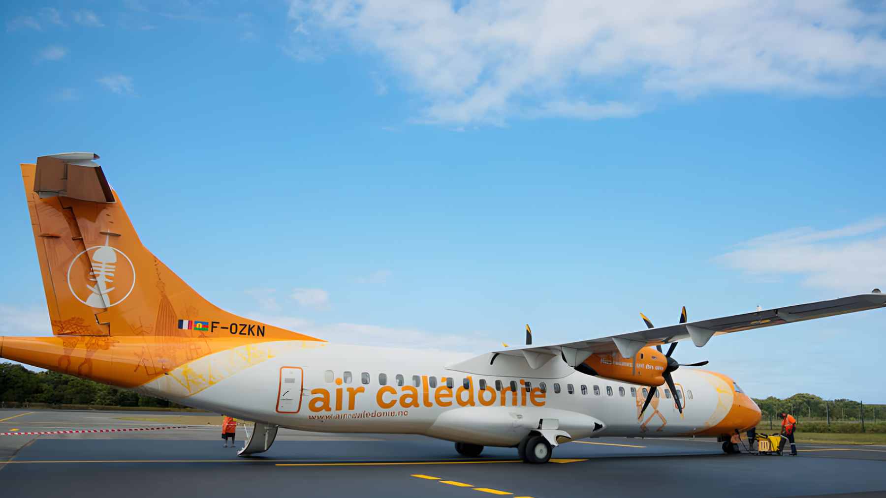 An Air Calédonie ATR 72-600 turboprop passenger plane parked on a regional runway in New Caledonia.