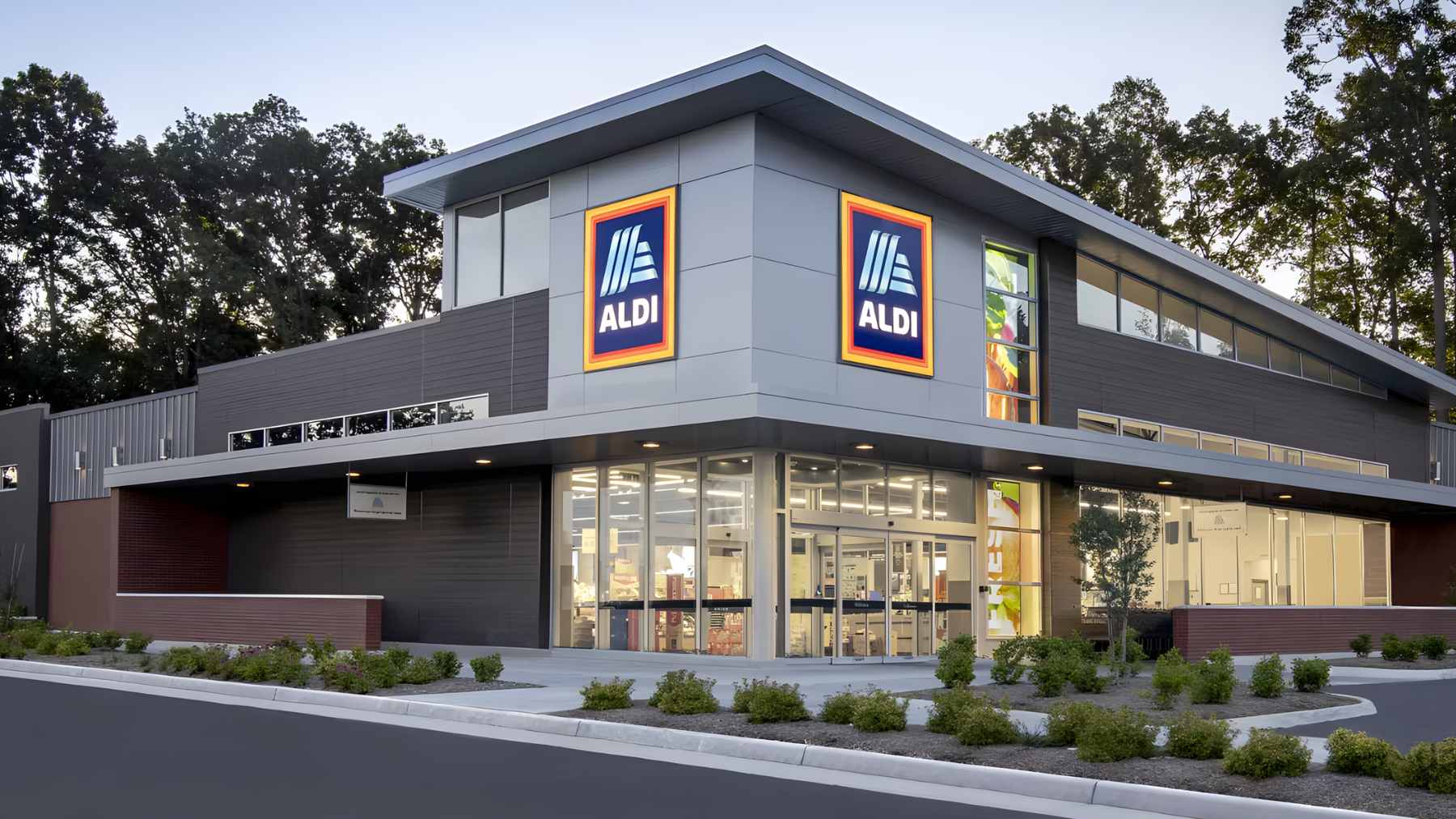 A set of Belavi solar-powered globe string lights hanging across a wooden patio fence at dusk, illuminating a backyard seating area.