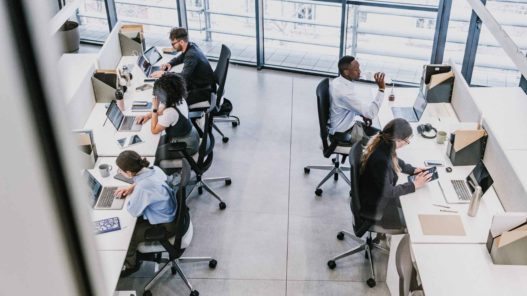 A crowded multi-lane highway packed with cars during a morning commute rush hour.