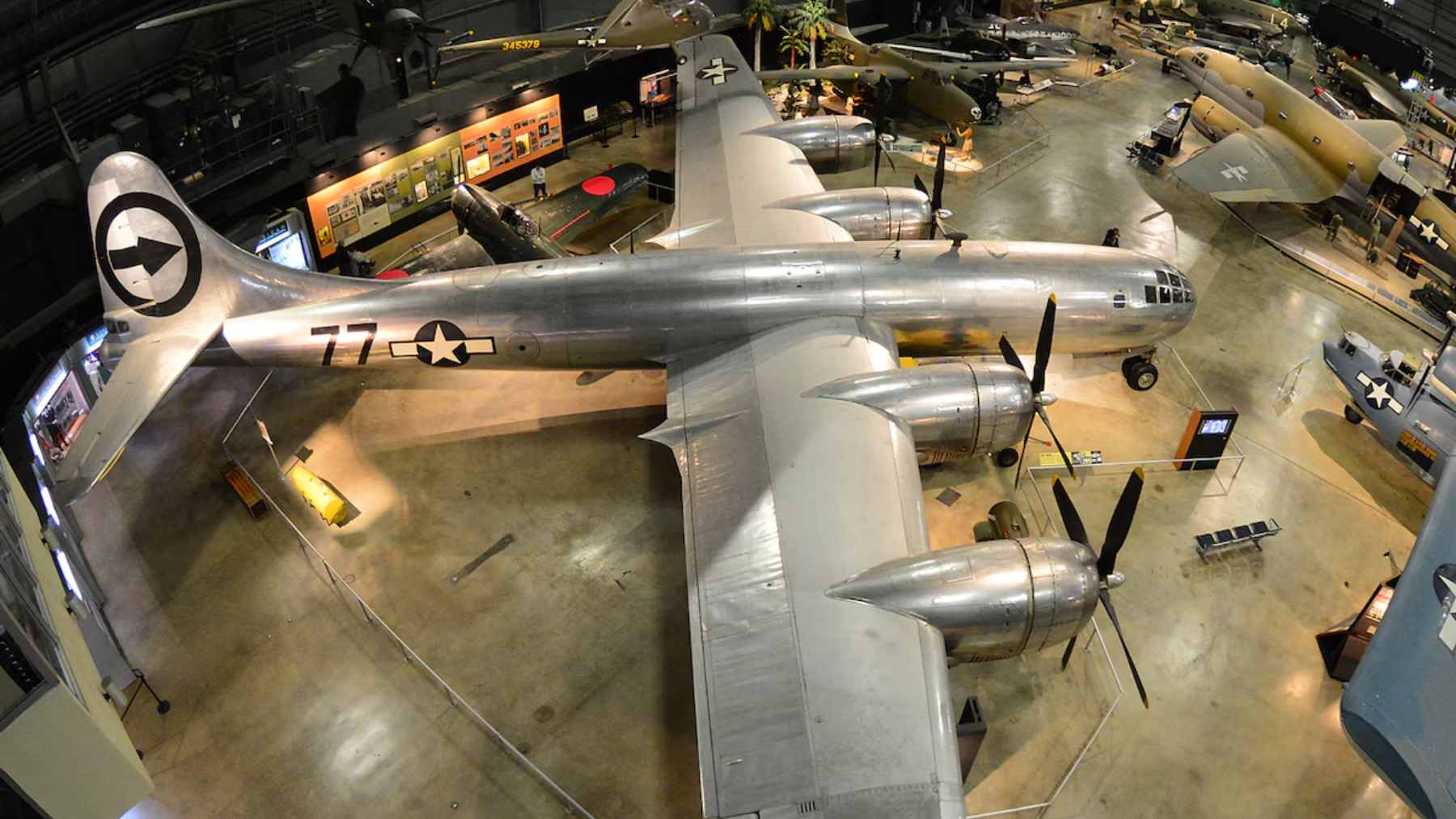 The restored Boeing B-29 Superfortress nicknamed "Doc" in flight, showing its polished aluminum exterior and four radial engines.