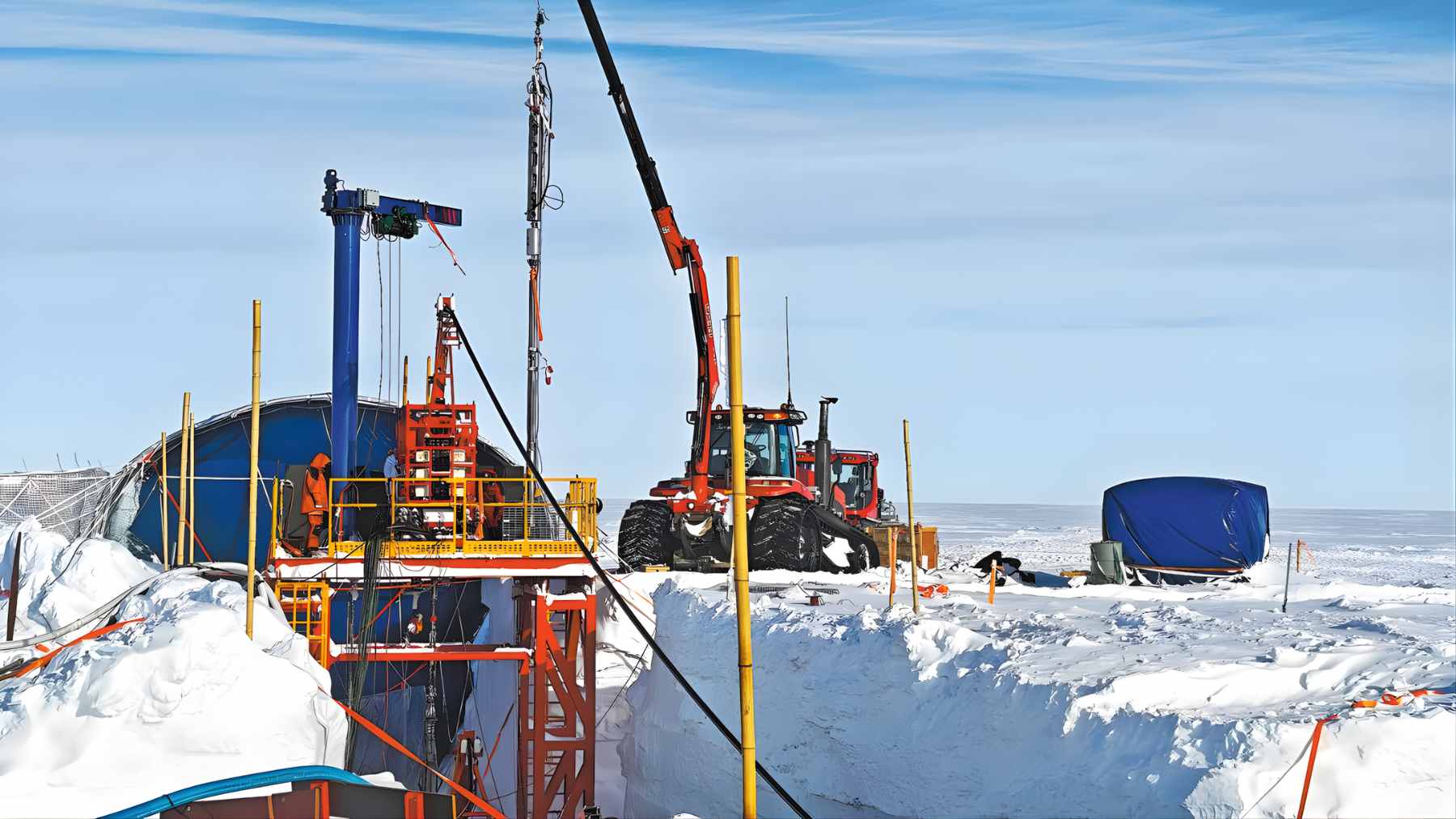 Chinese researchers operating a large hot-water drilling rig on the vast, white Antarctic ice sheet at the Qilin Subglacial Lake site.