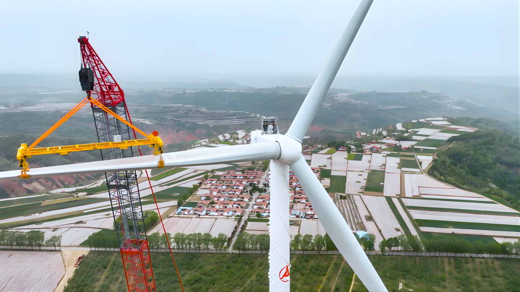 An expansive solar panel farm situated directly next to a modern, high-tech data center and battery storage facility.