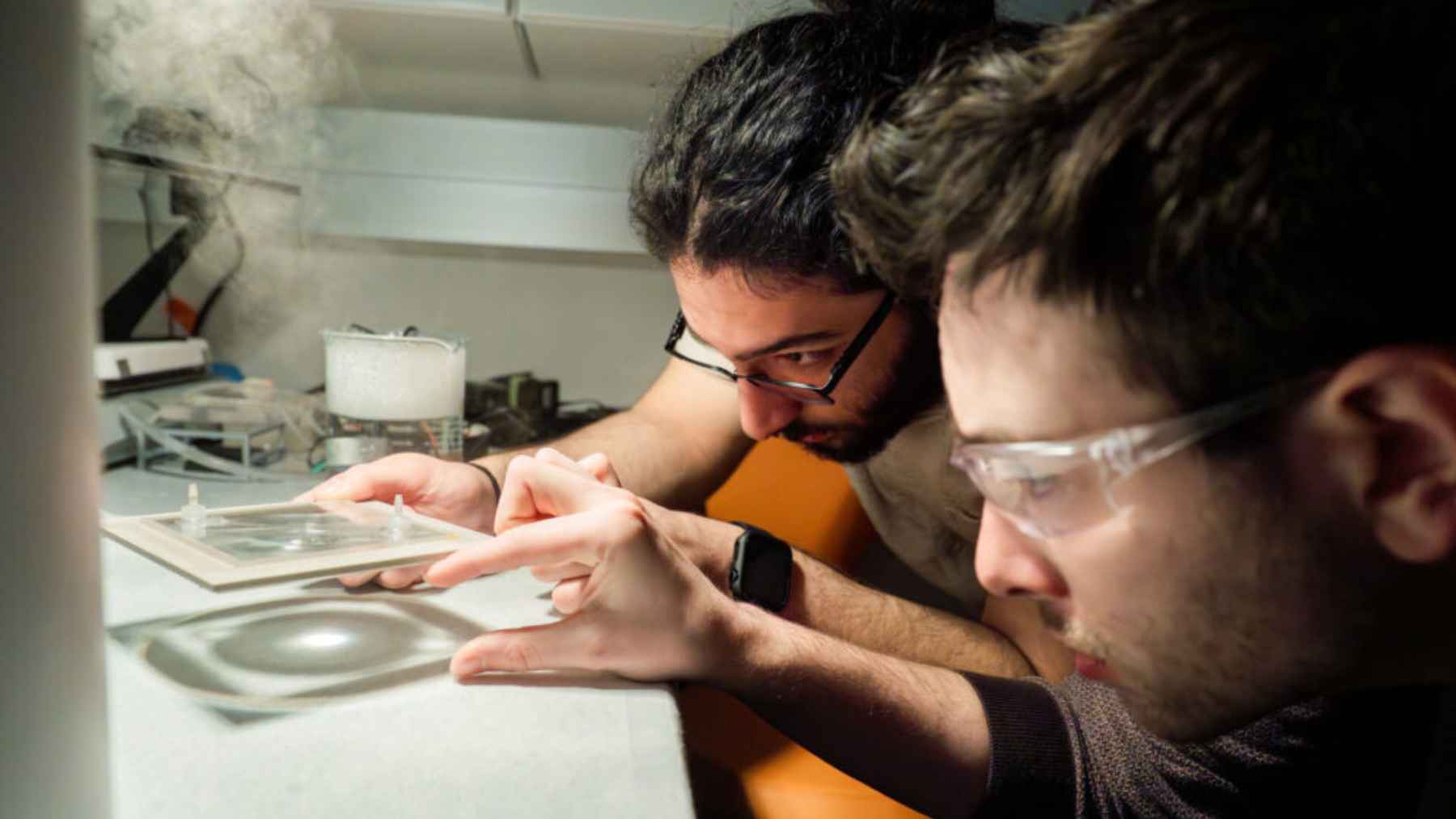 Researchers in a lab testing Harvard’s dual-mode solar device that can switch between heating and electricity generation