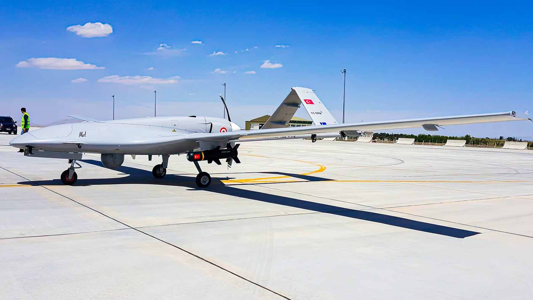 A medium-altitude military drone flying on a reconnaissance mission, representing Japan's shift toward unmanned aerial vehicles.