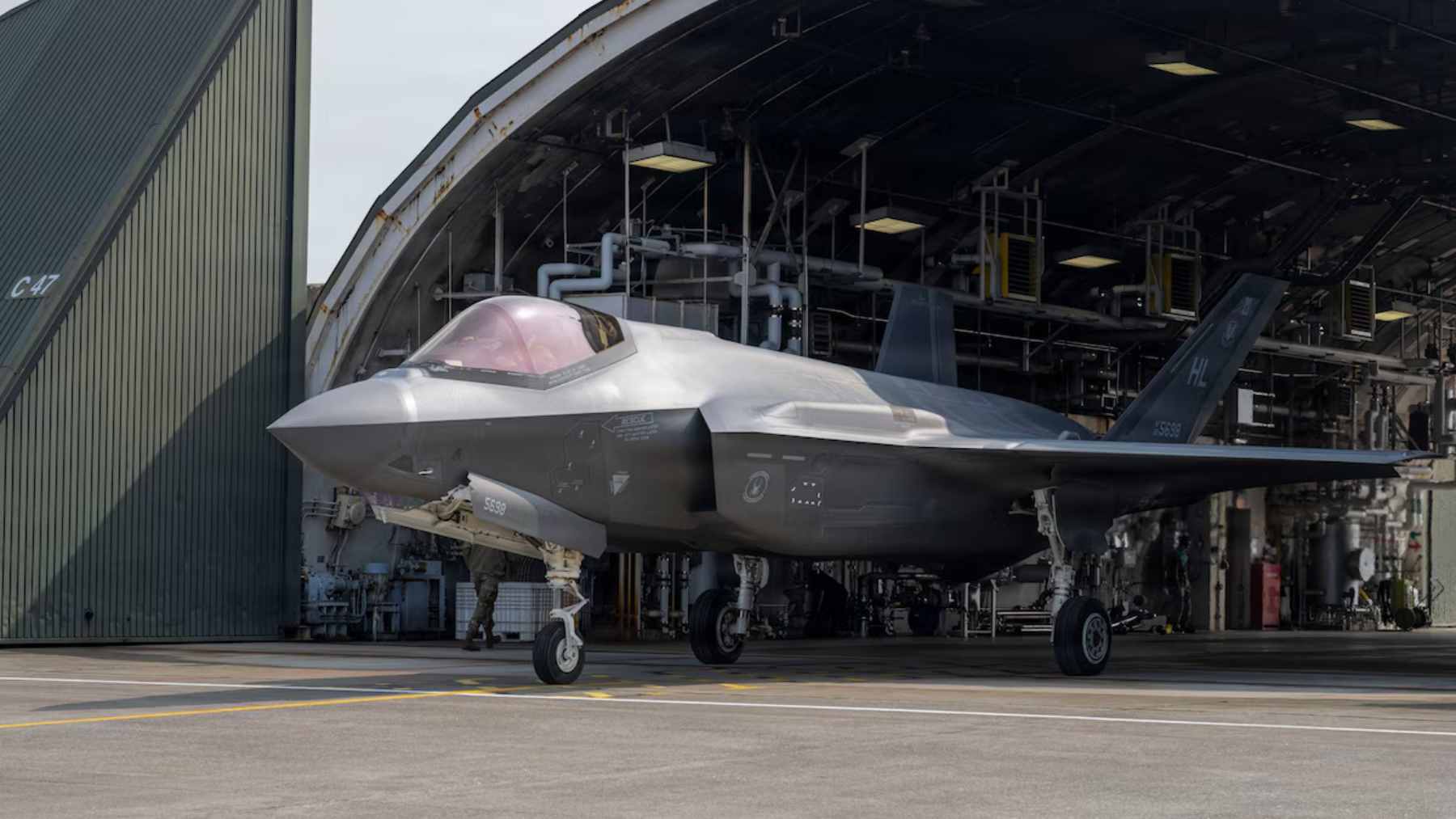 A U.S. Air Force F-35A Lightning II stealth fighter jet taxiing on the runway at Misawa Air Base in Japan.
