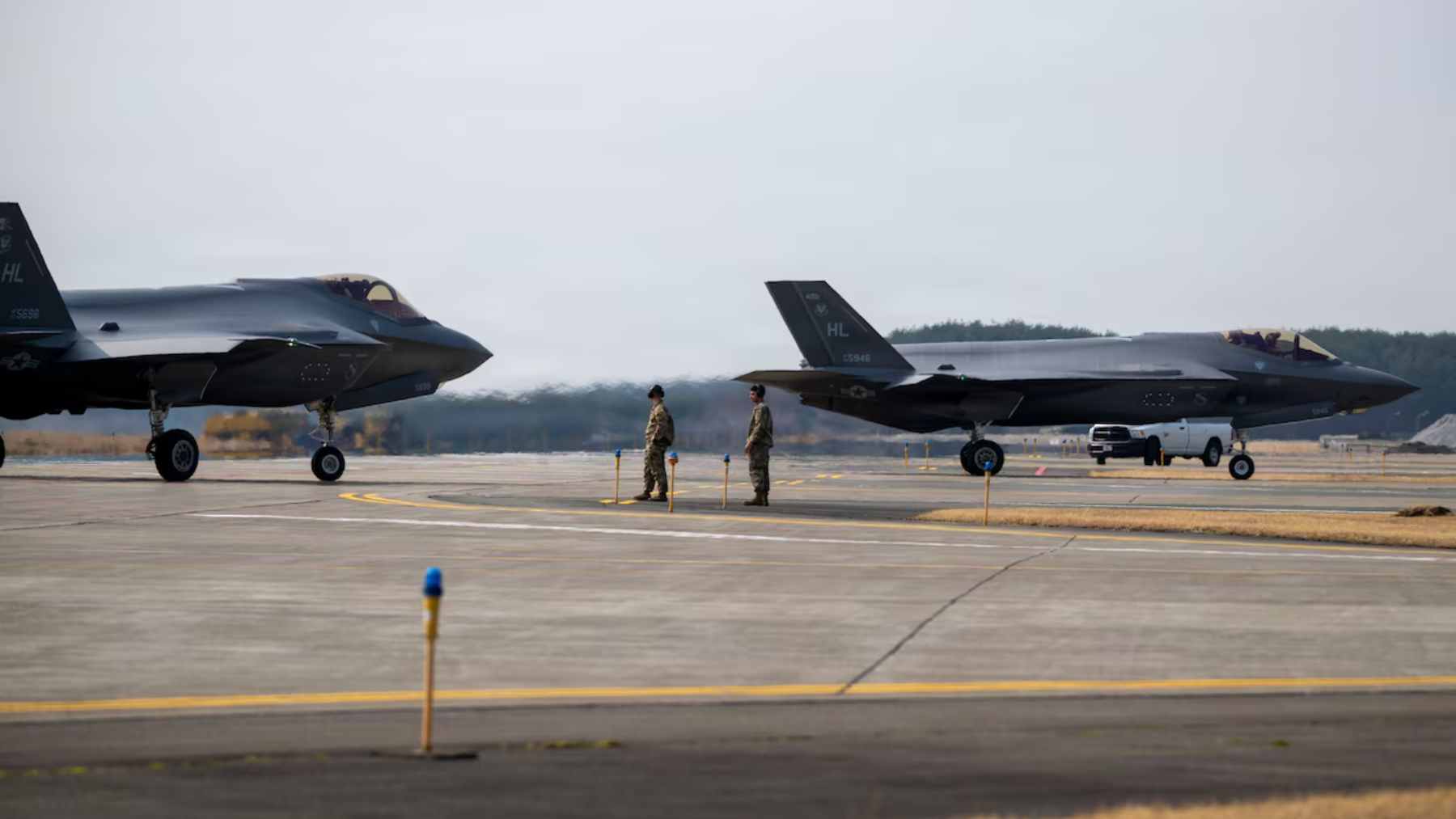 A U.S. Air Force F-35A Lightning II stealth fighter jet taxiing on the runway at Misawa Air Base in Japan.
