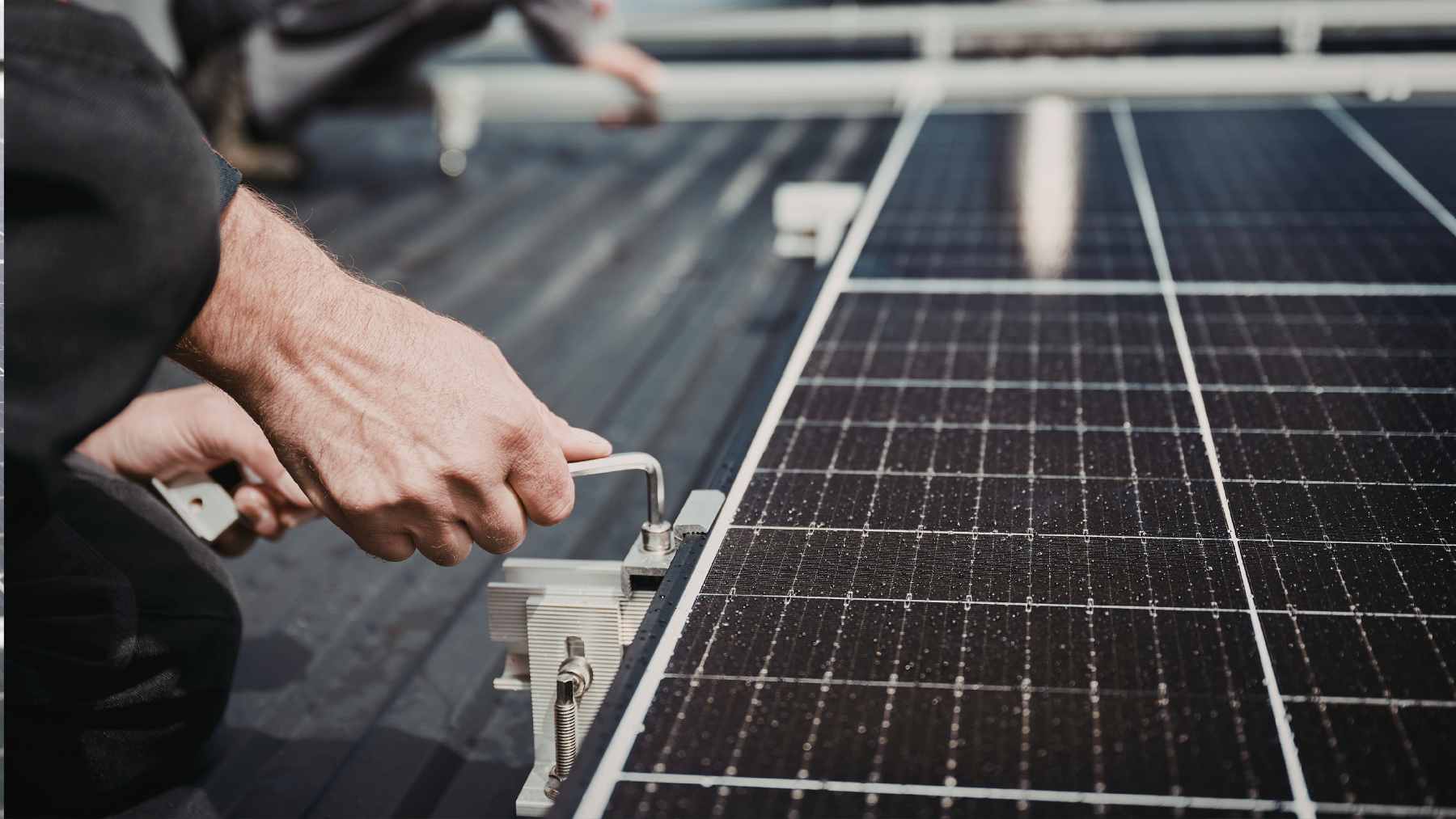 A close-up view of a prototype solar redox flow battery being tested under simulated sunlight in a laboratory setting.