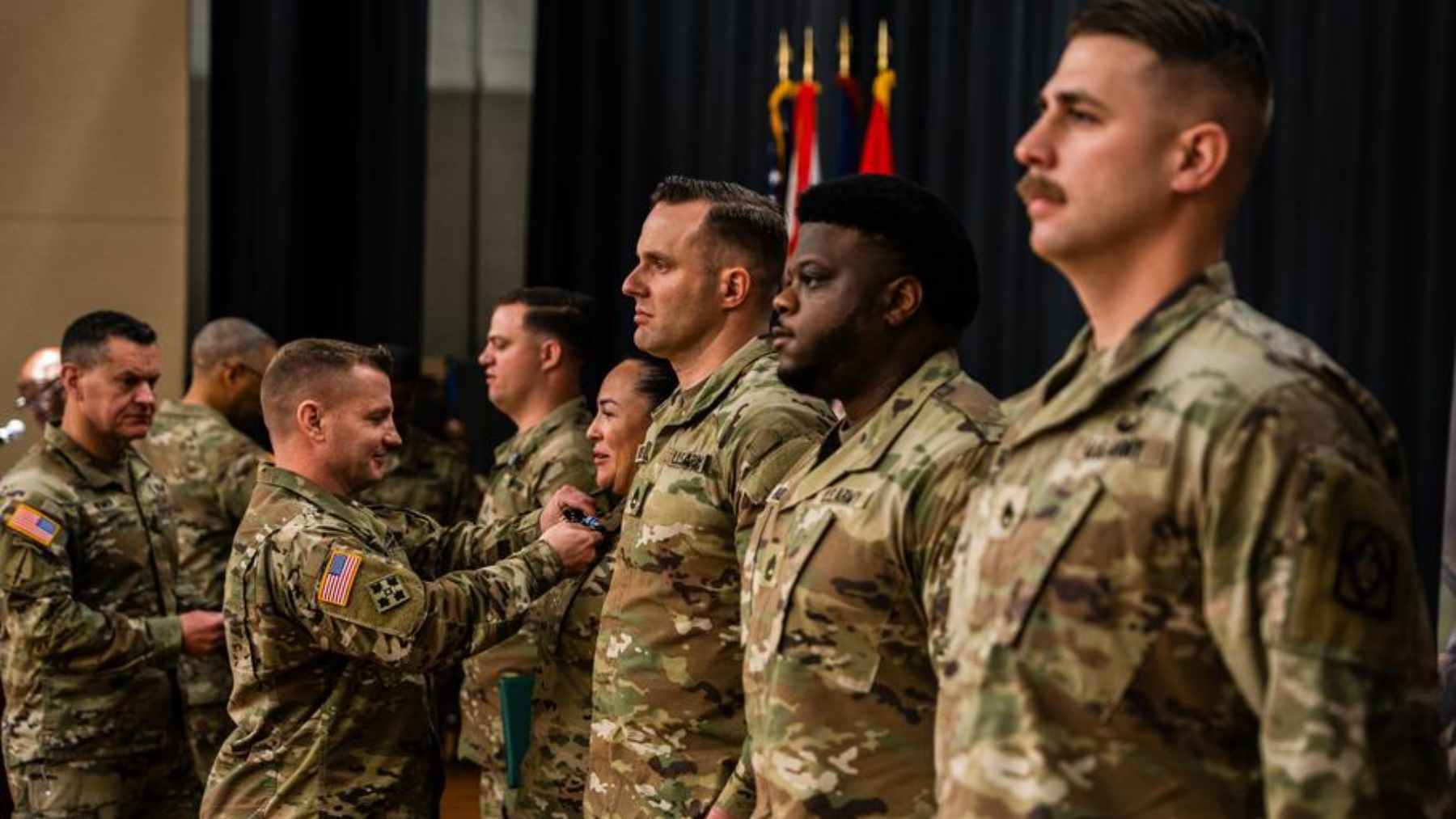 The U.S. wants to automatically register thousands of young people for potential recruitment, and the move is already sparking fears 1 A young American man looking concerned while reading news about automatic Selective Service military registration on his smartphone.